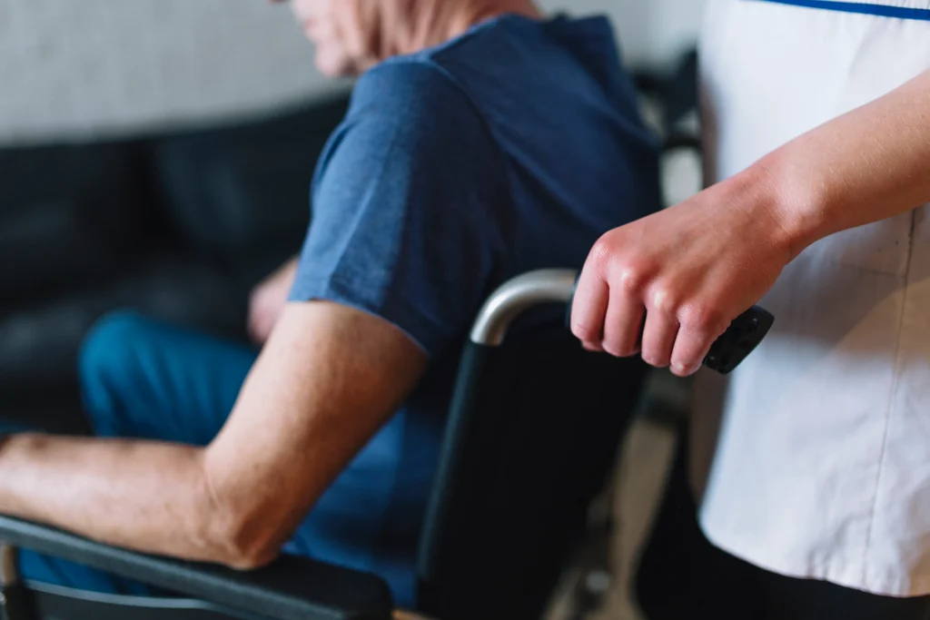 In-home elder care in Miami: nurse assisting senior in wheelchair